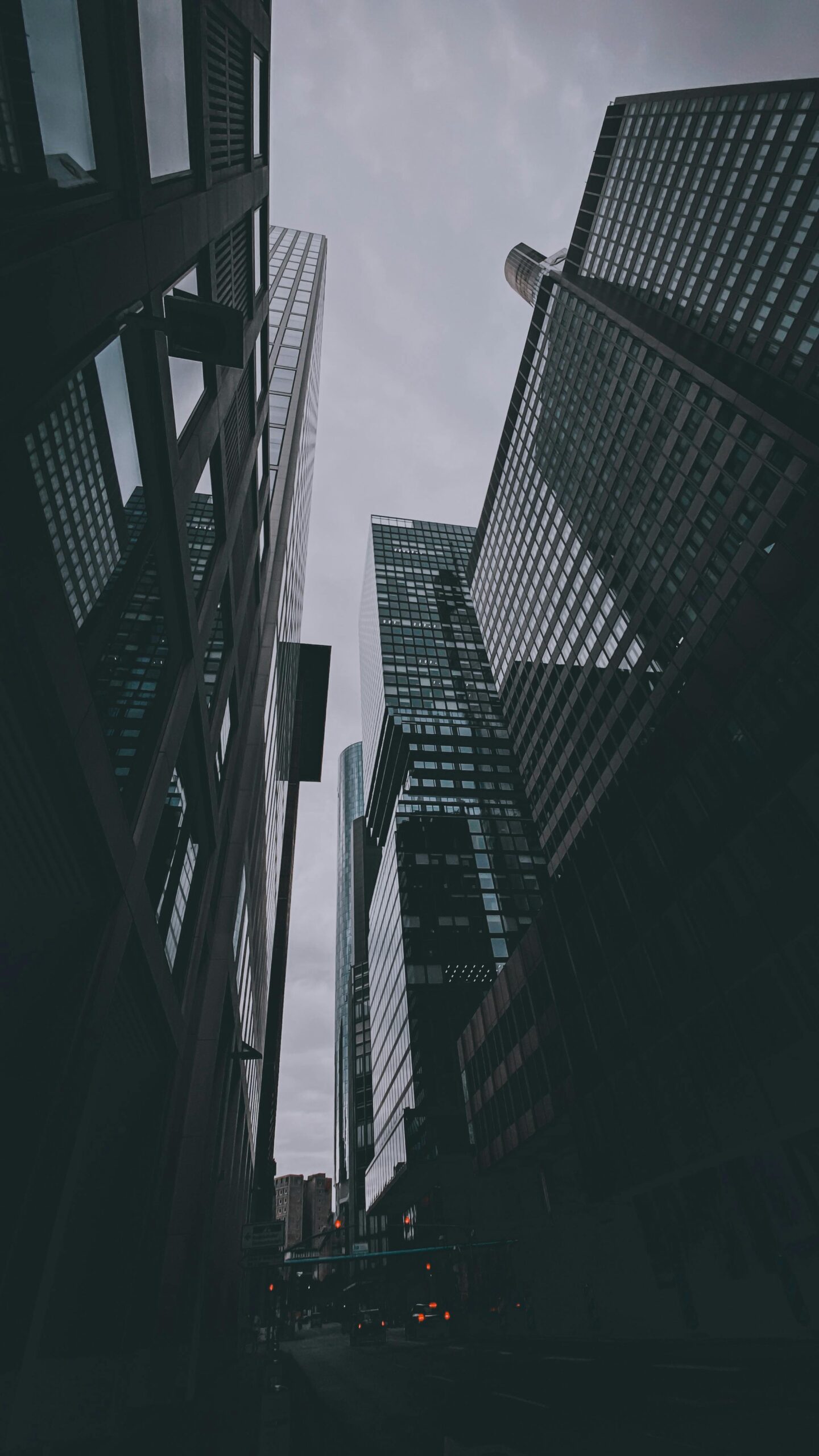 Dynamic cityscape featuring modern skyscrapers with a low-angle perspective, showcasing urban architecture.
